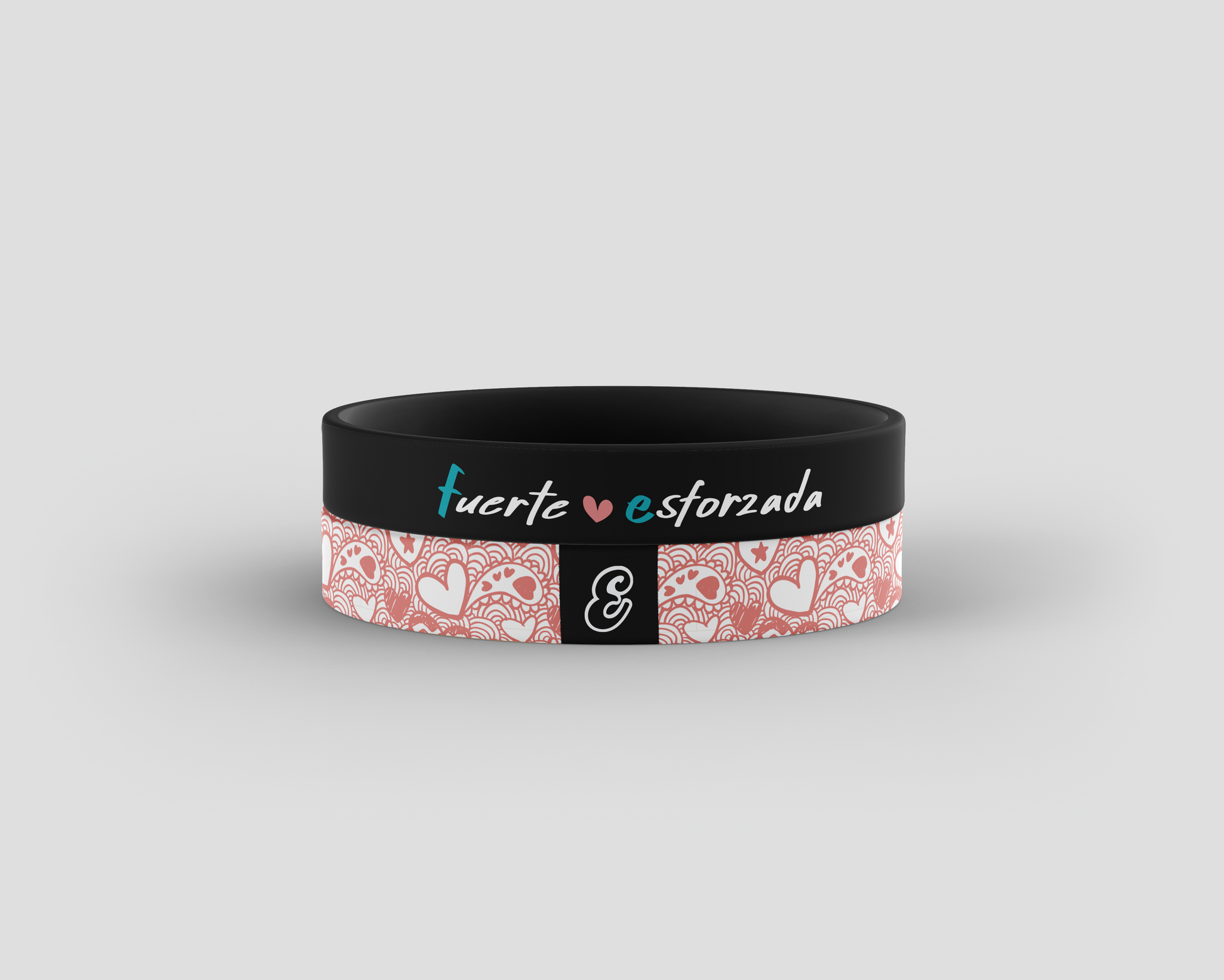 Black wristband with pink patterned section and text on a gray background